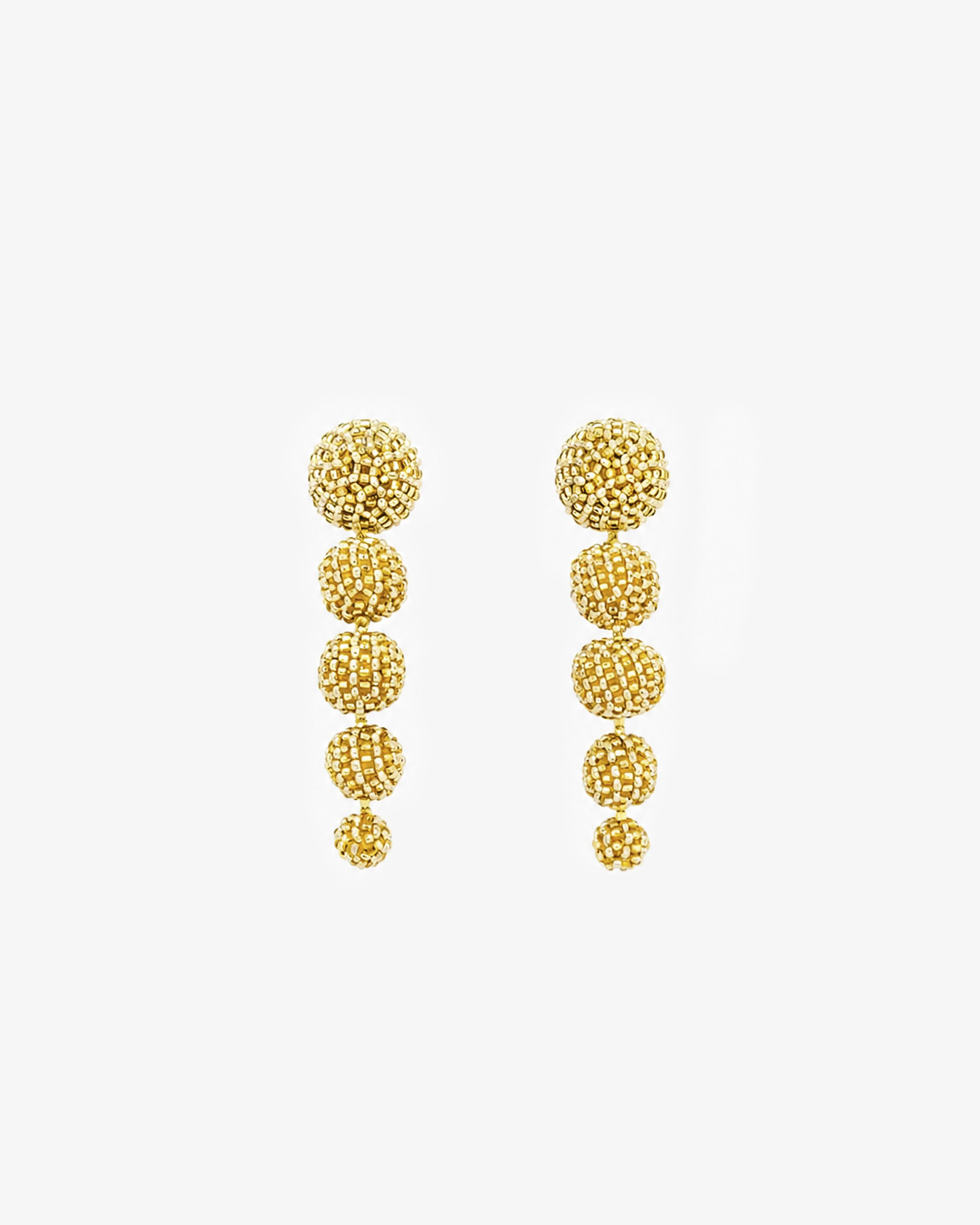 Long Sculptural Beaded Drop Golden Earrings — front view
