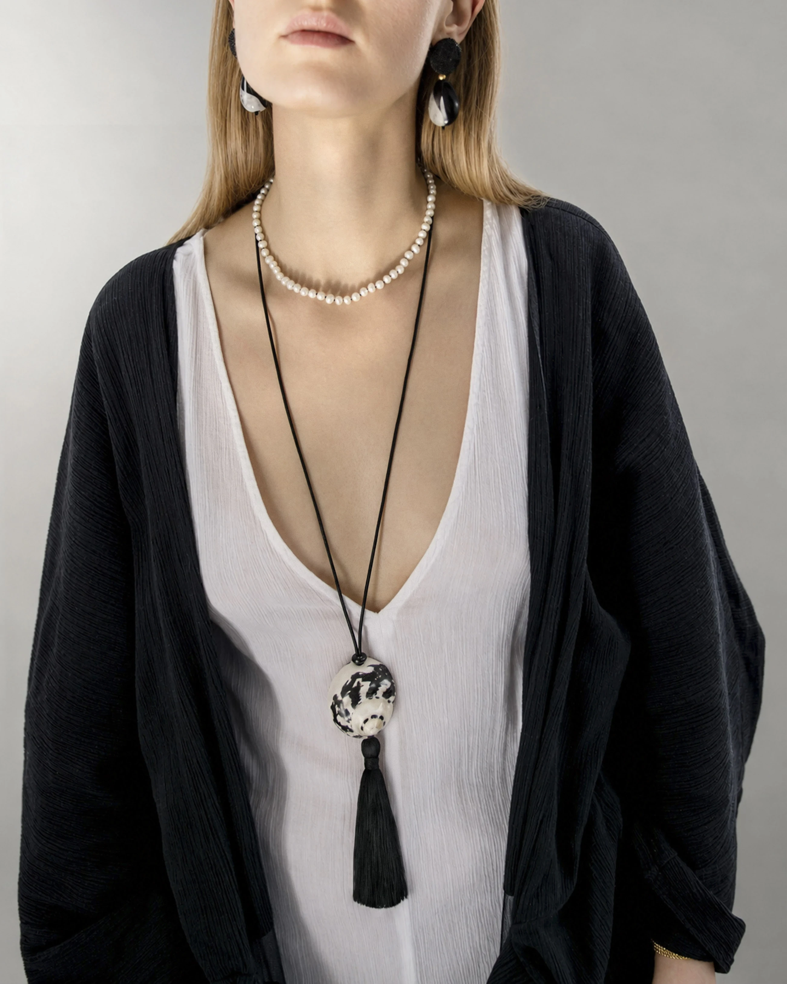 Black & White Shell Necklace With Tassel — Black & white shell necklace with long silky tassel, worn layered over a pearl necklace on a black kimono