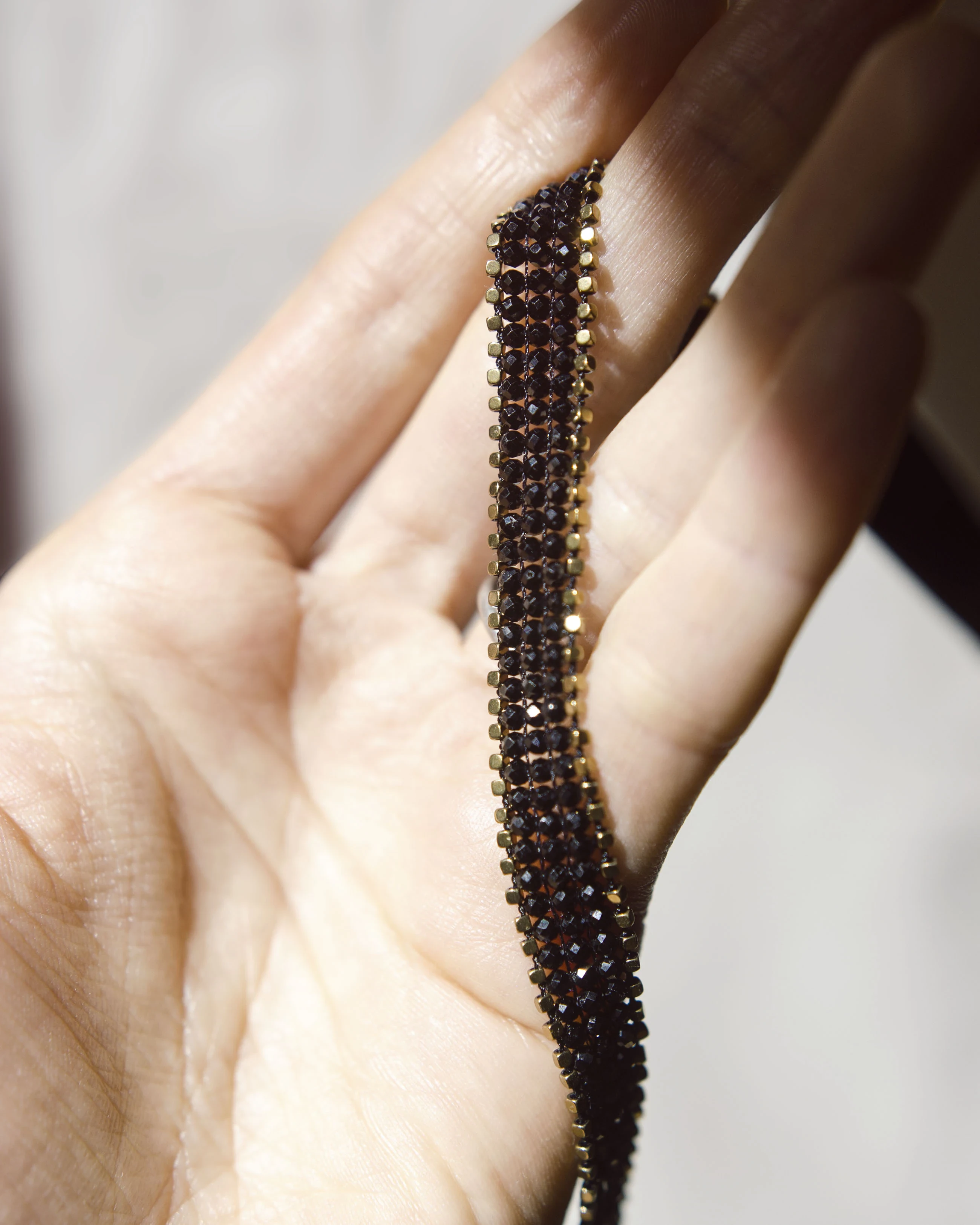 Black Spinel Choker with Golden Hematite — styled view